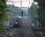 RE10433 von Aachen nach Dortmund Hbf mit Schublok 111 012 steht Abfahrtsbereit im Geilenkirchener Bahnhof, das Bild wurde von einem Weg etwas weiter weg aufgenommen :-) 8.5.10