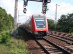 RE1 nach Brandenburg Hbf bei der Durchfahrt Potsdam Park Sanssouci.