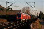 RB27 (RB 12574)  Rhein-Erft-Bahn  geschoben von der 143 025 ist bei Leutesdorf auf der Fahrt Richtung Kln Hauptbahnhof.