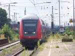 Der RE11  Rhein-Hellweg-Express  wird von einer 112 in den Bahnhof von Hamm(Westf) geschoben.