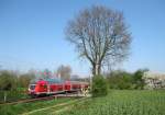 RE 21577 nach Hamburg Hbf berquert am 16.04.09 den B am Km 9.8 an der Kbs 140 bei Reeke.