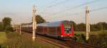 RE 21432 nach Lbeck Hbf entflieht am 13.06.09 dem Sonnenuntergang Richtung Lbeck Hbf.