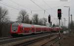 146 11*-* mit dem RE 5341 (Offenburg-Basel Bad Bf) begegnet RE 26514 (Basel Bad Bf-Offenburg) mit Schublok 146 11*-* in Efringen Kirchen 26.2.11