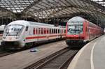 IC2217 von Züssow nach Stuttgart Hauptbahnhof begegnet am 13.07.2019 im Kölner Hauptbahnhof der RB27 (RB12518)  Rhein-Erft-Bahn  von Koblenz Hauptbahnhof nach Mönchengladbach