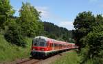 RE 28676 (Ulm Hbf-Donaueschingen) mit Schublok 218 410-9 bei Möhringen 19.6.15