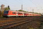 Die 111 046-9 schiebt den Wittenberger auf der RB von Garmisch nach Mnchen durch Mnchen Westkreuz am 25.04.2013