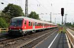 Einfahrt am 25.04.2014 vom Prototyp D-DB 50 80 80-35 100-2 der Bauart Bnrdzf 473.0 und der Freiburger Schublok 111 054 als RB von Schliengen nach Offenburg in den Bahnhof von Müllheim (Baden).