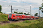 Geschoben von 147 018 rollt ein RE3 am 16.06.24 durch Wittenberg-Labetz und erreicht in Kürze seinen Zielbahnhof Wittenberg Hbf.