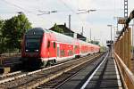 Ausfahrt am 17.04.2014 vom Freiburger Dosto-Stw. D-DB 50 80 86-81 048-0 als RB nach Offenburg und mit Schublok 146 114-4 am Zugschluss in Müllheim (Baden).