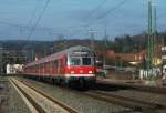 Die RB 59362 fhrt am 02.Mrz 2012 im Steuerwagensandwich und der schiebenden 111 166 in den Bahnhof Kronach ein.