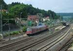 Eine RB nach Bamberg verlsst am 12.Juni 2013, mit schiebender 111 056, den Bahnhof Kronach Richtung Lichtenfels.