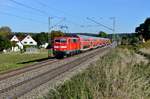 111 017 am 02. Oktober 2015 mit einem Doppelstockzug zwischen Rohrbach und Baar Ebenhausen. 