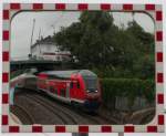 Spiegelbildlich - RE6 bei der Durchfahrt durch den Bahnhof Dsseldorf-Unterrath in Richtung Dsseldorf Hbf.