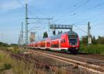 RE 21579 ist am 17.06.09 kurz nach der Ausfahrt aus Bad Oldesloe Richtung Hamburg Hbf unterwegs.