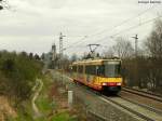 11.03.2011: Wagen 822 mit Werbung der Albtherme Waldbronn als S9 von Bruchsal nach Bretten. Gerade hat er den Haltepunkt Bruchsal-Schlachthof verlassen und strebt dem nchsten Halt Heidelsheim Nord entgegen. Die Kirche im Hintergrund ist die St. Peterkirche von Bruchsal.