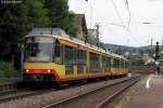 10.05.2011: Wagen 849 mit Werbung  mobility 4u - deine persnliche Freiheit  verlsst mit einem weiteren Triebwagen den Bahnhof Grtzingen.
