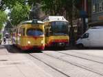 Ein alter Straenbahnwagen der Linie 5 trifft auf einen modernen Zweisystem Stadtbahnwagen GT8 der AVG in der Karlsruher Innenstadt in der nhe der Marktplatzes. Da die VBK auf der 
Linie 5 nur diese alten Triebwagen einsetzt treffen in Minuten Takt historische und moderne Triebwagen dort aufeinander. Auerdem dadurch, dass viele S- und Straenbahnlinien um dem Marktplatz aufeiander treffen kommen dort Bahnen im Minuten Takt. Ein Paradies fr Eisenbahn Fotographen.     