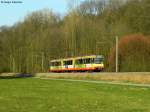 22.03.2011: Wagen 811 mit Werbung von Volkswohnung auf dem Weg von Menzingen nach Karlsruhe Hbf. Aufgenommen zwischen Bahnbrcken und Gochsheim.