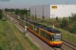 Wagen 877 in seinem neuen Look mit dem AVG-Logo und ein weiterer Triebwagenals S31 nach Karlsruhe Hbf. Im Hintergrund ist noch der S-Bahn-Langzug (3 Triebwagen) nach Freudenstadt Hbf zu erkennen. Aufgenommen am 25.05.2011 bei Malsch.