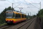 Wagen 877 in seiner neuen Lackierung in dahliengelb kombiniert mit signalrot und dem AVG-Logo.