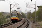 TW 851 und TW 8** erreichen am 15.04.2012 als S4 Eilzug nach Karlsruhe Albtalbahnhof den Haltepunkt Wssingen Ost. Das Bild entstand legal vom Zugangsweg zum Haltepunkt.