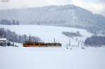 Winterliches Murgtal. Whrend eines Schneeschauer fahren zwei AVG-Triebwagen, der vordere im Neulack, der hintere im Altlack nach Freudenstadt hinauf. Aufgenommen am 09.02.2013 bei Rt bei etwa 40 cm Schnee.