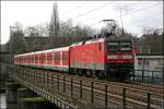 143 581 schiebt am 02.03.2008 eine S-Bahn der Linie S5 von Mnchengladbach Hbf nach Dortmund Hbf. Aufgenommen bei der berquerung des Harkortsee bei Wetter(Ruhr).
