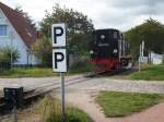 Nachdem 99 4011 am 30.September 2009 ihren Zug nach Binz gebracht hatte und der Zug in Binz endete mute die Lok wieder umsetzen.Hier stand die Lok an der Ausfahrt nach Putbus.