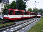 Eine Begegnung von zwei Doppeltraktionen aus Stadtbahnwagen B der Rheinbahn zwischen dem Rheinbahnhaus und dem Belsenplatz am 30.