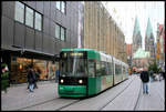 Die moderne grün lackierte Tram 3017 fährt hier am 6.12.2006 vor der Dom Kulisse durch die weihnachtlich geschmückte Bremer Innenstadt.