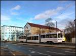 Tram 143 der Cottbusverkehr mit Ganzwerbung auf der Strae der Jugend, 04.01.07.