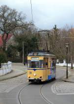 Auf der Rudolf-Breitscheid-Straße ist Tw 28 der Woltersdorfer Straßenbahn am 20.11.2015 in Richtung Woltersdorf Schleuse unterwegs