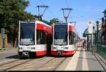 MGT-K (Bombardier Flexity Classic), Wagen 672 und Wagen 6??, der Halleschen Verkehrs-AG (HAVAG) als Linie 1 von Frohe Zukunft nach Südstadt, Veszpremer Straße, treffen auf MGT-K-2, Wagen 698