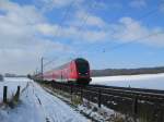 RE 21416 Hamburg Hbf - Lbeck Hbf rast am 14.02.09 durch die verschneite Landschaft zum nchsten Halt nach Reinfeld (Holst.).