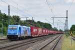 186 941 kommt mit einem voll beladenen Containerzug durch Niederdodeleben gen Helmstedt gefahren.