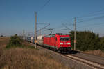 185 357-1 mit einem Ganzzug GATX und VTG Falns in Richtung Osten auf der KBS 310 an der Stadtgrenze zwischen Magdeburg und Niederndodeleben.