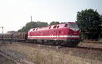 229 128-4 im August 1997 bei der Ausfahrt mit Holzzuges aus Mühlhausen.