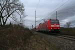 146 113-6 mit einem RE von Offenburg nach Basel SBB am Nachmittag des 14.02.14 sdlich des Bahnhofs Mllheim (Baden).