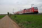 146 116-9 mit einer RB von Neuenburg (Baden) nach Freiburg (Breisgau) Hbf am Nachmittag des 18.04.14 sdlich von Hgelheim.