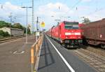146 238-1 mit einem RE von Offenburg nach Schliengen am Nachmittag des 24.04.14 beim Verlassen des Bahnhof Mllheim (Baden).