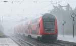 146 233-2  Donaueschingen  mit dem IRE 5191 (Karlsruhe Hbf-Kreuzlingen) beim Halt in St.Georgen(Schwarzw) bei strmenden Regen am 2.7.09