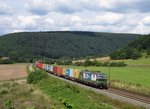 193 236 von ELL (WLC) zieht am 11.August 2016 einen Containerzug bei Gambach in Richtung Wrzburg.