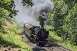 001 180-9 bewältigt mit Volldampf die Schiefe Ebene. Kurz vor Marktschorgast ist das Ende der Steigungsstrecke fast erreicht. 04.06.2015

Hersteller: Henschel, Kassel
Fabriknummer: 22923
Abnahmedatum: 27.05.1936
Erst-Bw: Paderborn
weitere Beheimatungen: Hagen-Eckesey, Köln Bbf, Osnabrück, Kaiserslautern, Nürnberg Hbf, Würzburg, Hof
Betreibernr. z.Z.d. Aufnahme: 001 180-9
ursprüngl. Fahrzeugnr.: 01 180
Umzeichnungen: 001 180-9 (01.01.1968)
z-Stellung (DB): 31.05.1973
Ausmusterung (DB): 24.08.1973 
Eigentümer z.Z.d. Aufnahme: BayernBahn Betriebsgesellschaft, Nördlingen