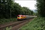 1116 232 wird mit dem OEC 663  WILKOMMEN IM PARLAMENT  auf der Fahrt von Feldkirch nach Wien West bei Oberaudorf abgelichtet. (04.07.2008)
