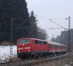 111 023-8 zieht den RE 30017  Mnchen-Salzburg-Express  kurz nach dem Halt in Grokarolinenfeld gen Rosenheim. 8.2.10