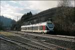 Im leichten Gegenlicht ist der ET23003 als ABR99623 (RE16  Ruhr-Sieg-Express ) von Siegen nach Essen Hbf unterwegs. (19.03.2008)