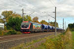 Mit einem Kalizug am Haken rollt 187 420 der EBS am 04.11.23 durch Brehna Richtung Halle(S).