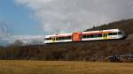 Die Hellertalbahn fhrt am 19.02.2012 mit einem Stadler GTW 2/6 Richtung Betzdorf, hier bei Herdorf-Sassenroth.