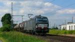 Siemens-Vectron X4E-871 (193 871) von MRCE zieht einen Kesselwagenzug durch Porz-Wahn Richtung Süden. Aufgenommen am 31/05/2014.
