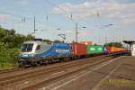 182 911-8 der Mittelweserbahn mit einem bunten Containerzug auf der Fahrt in Richtung Magdeburg in Schnebeck (Elbe).